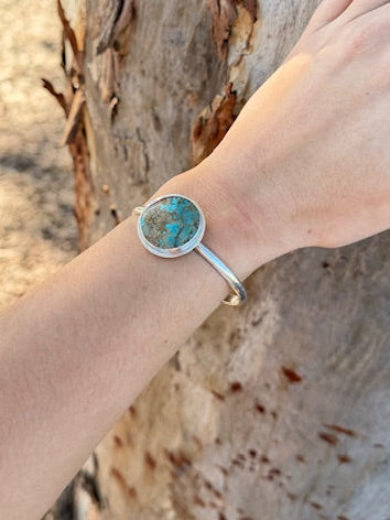 Handcrafted silver cuff with round turquoise stone