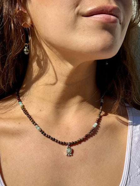 Natural bone beaded necklace with turquoise charm